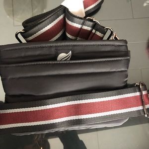 New Think Roylin bag. Comes with shoulder strap and belt strap